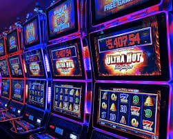 Boom City studio layout with Dragon Tiger, Sic Bo, and roulette tables visible on gb777 login
